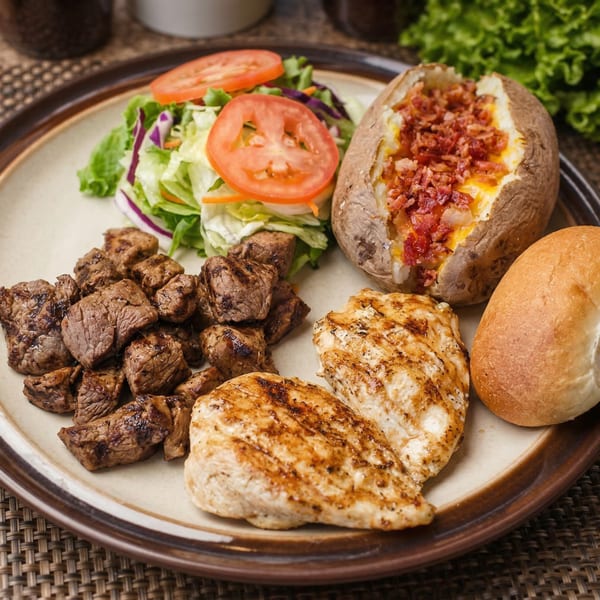 Steak-Out Charbroiled Delivery combo with steak bites, grilled chicken, baked potato, salad, and roll.